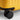 Yellow carry on suitcase closeup of Hinomoto 360 spinner wheels