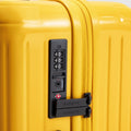 Yellow carry on suitcase closeup of TSA approved lock